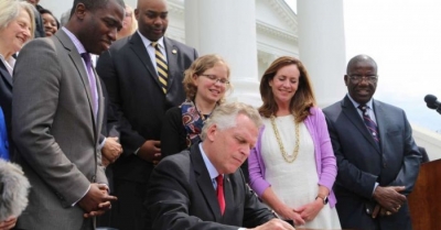 Virginia Governor Terry McAuliffe signs an order restoring voting rights to more than 200,000 Virginians on April 22, 2016.