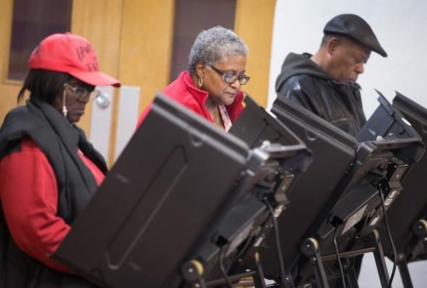Residents cast their votes at a polling place on Nov. 4, 2014 in Ferguson, Missouri. The Brennan Center found only four cases of in-person voter fraud in the state.
