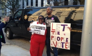 Atlanta residents protest voter suppression measures in the lead up to the 2014 election.