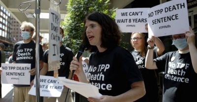 A protester speaks outside the hotel where the Trans-Pacific Partnership Ministerial Meetings are being held in Atlanta, Georgia. 