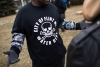 A shirt worn by a man during a rally displays a poisonous logo alongside the text 'City of Flint MI Water Dept.' on January 24, 2016 at Flint City Hall. 