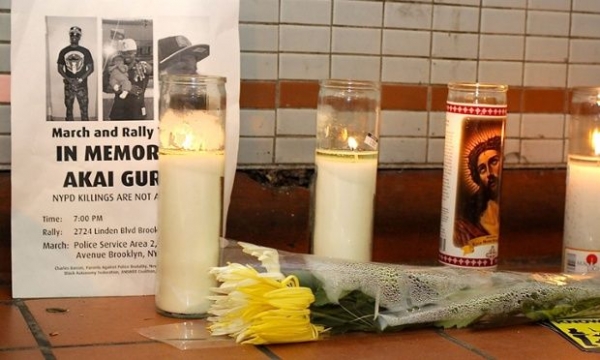 A makeshift memorial to Akai Gurley at the Louis Pink Houses in Brooklyn, New York. Gurley was shot dead by NYPD officer Peter Liang. 