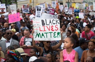  Demonstrators protest the death of Eric Garner on August 23, 2014, in Staten Island. 
