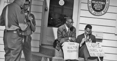 Partcipants of a fair housing protest that took place in Seattle in 1964. The Fair Housing Act was signed by LBJ just four years later, in 1968, in the wake of Martin Luther King Jr.'s assassination. Now, advocates worry the law is under threat. 